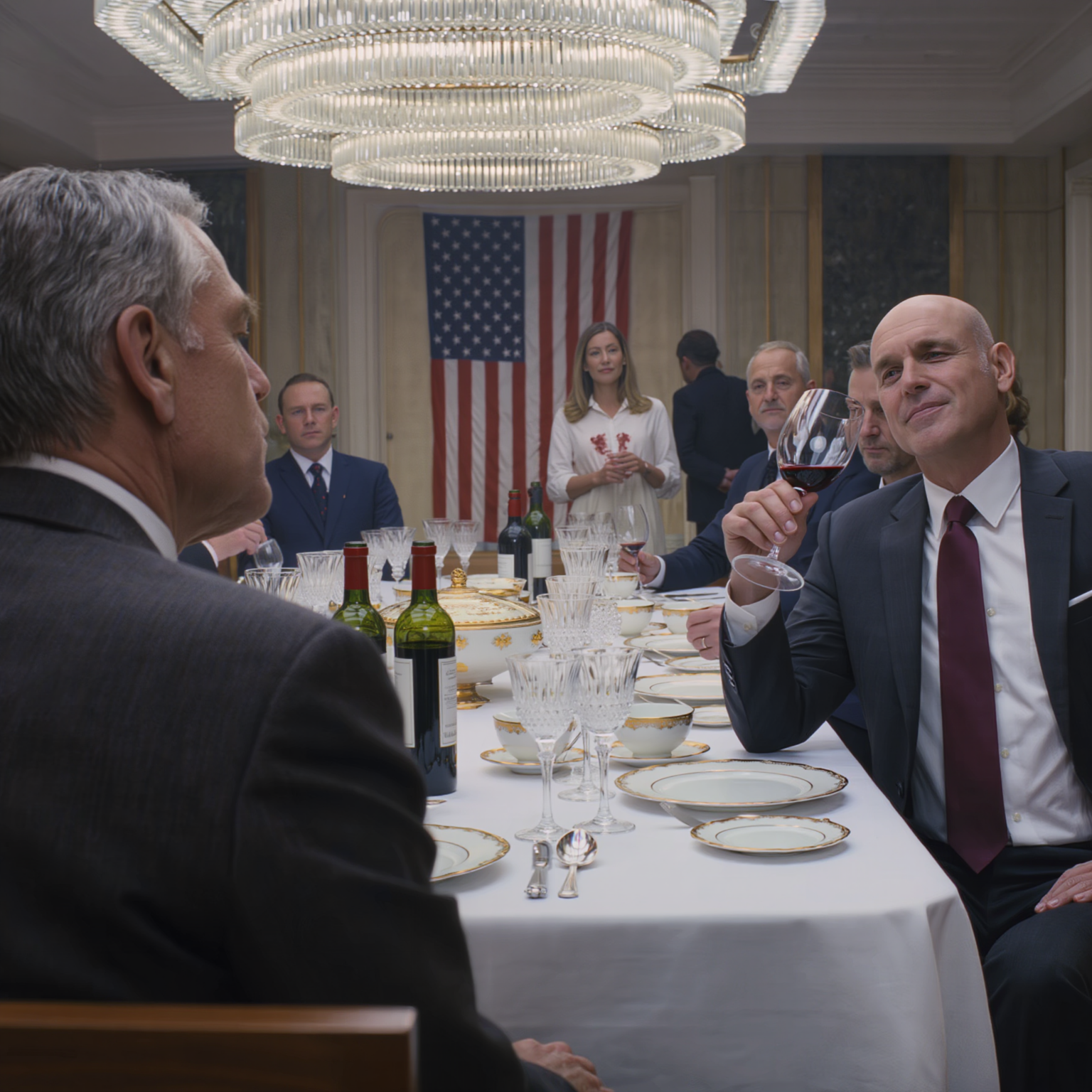 During Thanksgiving dinner at my daughter’s in-laws’ mansion, her father-in-law threw a glass of red wine straight in her face, and her husband sneered, “Thanks, Dad, maybe that’ll teach her some respect!” I gripped the armrest tight, stood up, excused myself into the hallway, and made exactly one phone call—because they had no idea who they’d just messed with.